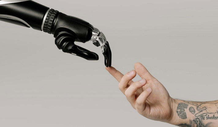 Bionic Hand And Human Hand Finger Pointing