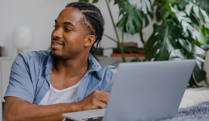 Man Sitting With Laptop