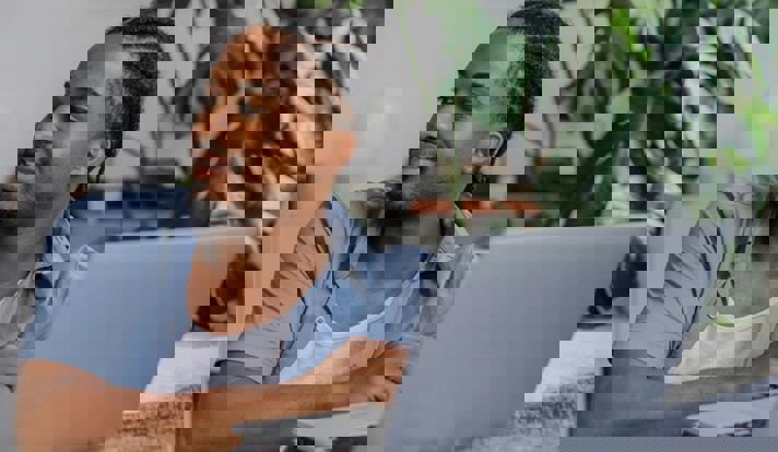 Man Sitting With Laptop